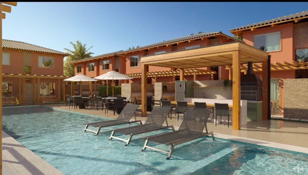 RCM Construção - Área de lazer com piscina, espreguiçadeiras e quiosque em um ambiente residencial.